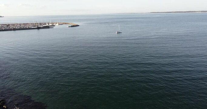 Calm and magnificent baltic sea lapping the rocky beaches at Helsingor near Kronborg castle on a sunny day, aerial view