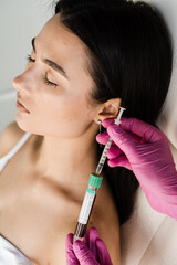 Cosmetologist with test tube with blood and plasma for PRP Platelet Rich Plasma procedure. Platelet...