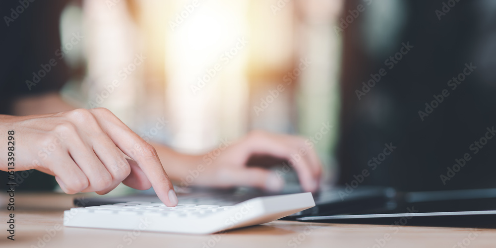 Poster Businessman using a calculator to calculate numbers ,profit and loss statement review of company performance ,Cost analysis and calculation of financial documents ,business account checking