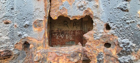 old rusty door hole