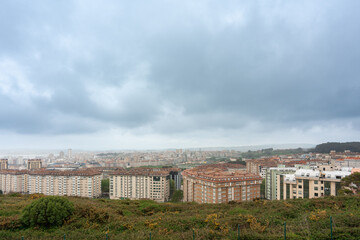Fototapeta na wymiar elevated view of the buildings and sky of the city of La Coruña in Galicia, Spain, 