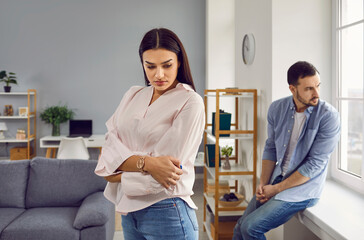 Young married woman and man are angry at each other after a quarrel or argument. Concept of family...