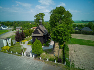 A wooden, historic church in the village of Suchcice, Poland.