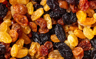 Multicolored raisins as a background. Macro