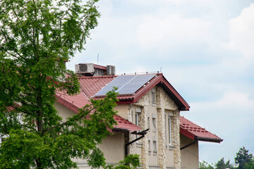 Fototapeta na wymiar Installing a Solar Cell on a Roof.