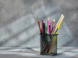 Black pencil case with pens