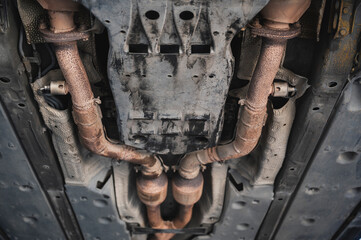 Close-up of automotive oxygen sensor or O2 sensor mounted on car exhaust system.