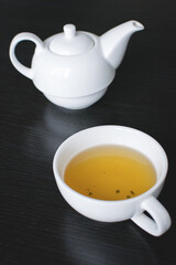 Afternoon black tea with white teapot