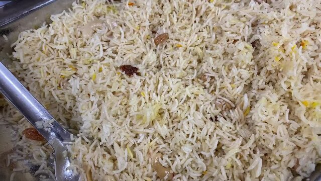 Kashmiri modur pulao made of rice cooked with sugar, water flavored with Saffron.