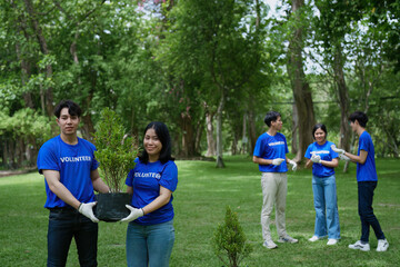 Volunteers of various nationalities are showing solidarity by sacrificing their personal time by planting trees to restore nature to reduce carbon dioxide in the air.