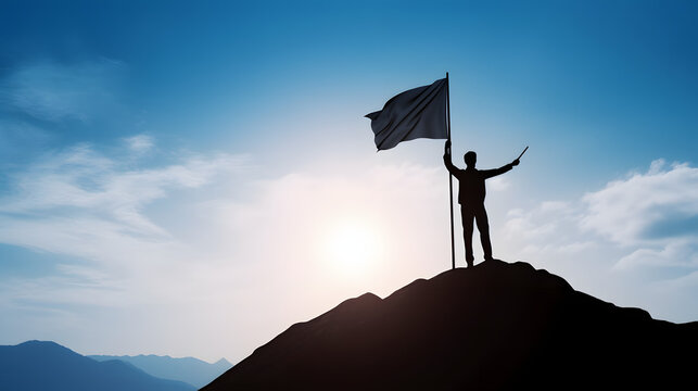 Silhouette of businessman holding flag on the top of mountain with over blue sky and sunlight. It is symbol of leadership successful achievement with goal and objective target.