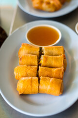  Fried Chinese Traditional Spring rolls food in ceramic plate (beautiful shape) on white background