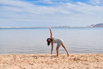 Woman having fun on the beach and sea