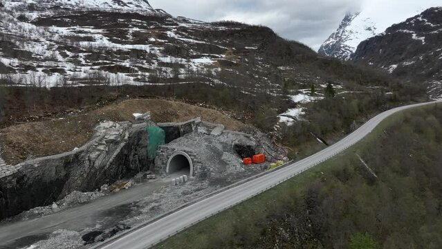 Tunnel between Korsmyra and Eidsdal at Ornevegen close to Geiranger Norway - Spring Aerial showing tunnel exit while still under construction