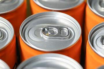Aluminum cans top view, closeup open ring from sweet so da drink can orange flavor, natural light.