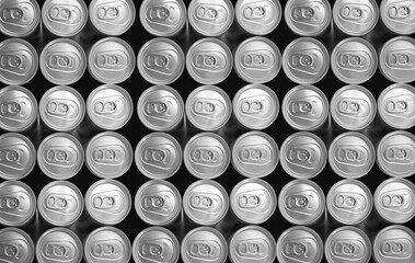 Monochrome color Abstract pattern many soda drinks cans top view on dark background. Recycling aluminum or metal empty cans from above. Group of cans for reuse and recycle.