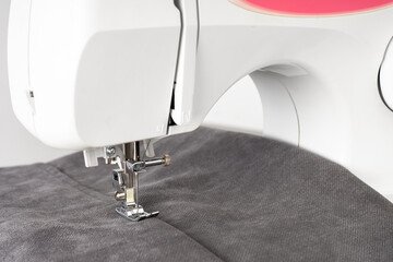 Modern sewing machine with gray fabric and. Sewing process clothes, curtains, upholstery. Business,...