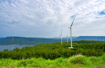 Huge fields of wind turbines used to generate electricity are located in the mountains where the wind blows constantly.