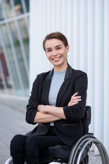 Businesswoman with a disability who uses a wheelchair posing