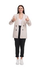 Beautiful businesswoman in suit showing thumbs up on white background