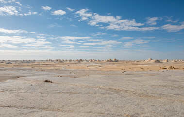 Barren desert landscape in hot climate with rock formation