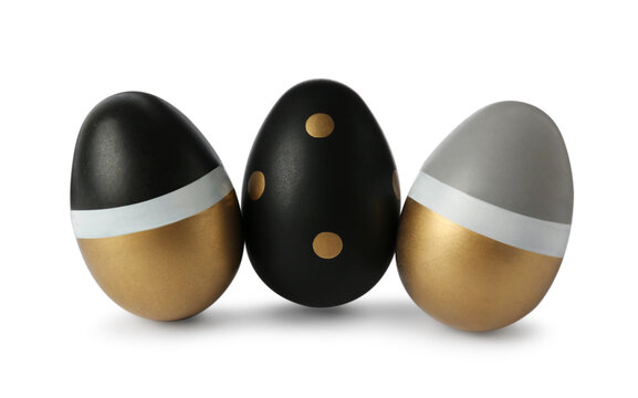 Three stylish painted eggs on white background