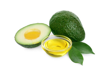 Bowl of oil and fresh avocados on white background