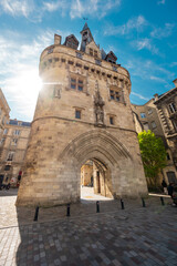 The door or gate Porte Cailhau is beautiful gothic architecture from the 15th century. It is both a defensive gate and triumphal arch. Bordeaux, France. High quality photography.