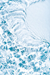 The texture of water on a white background in bright sunlight.