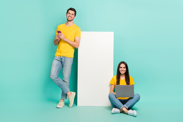 Photo of shiny positive husband wife dressed yellow t-shirts chatting twitter telegram empty space...