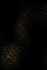 Gold glitter texture on black background. Festive background. Golden grainy abstract texture on a black background. Design element.