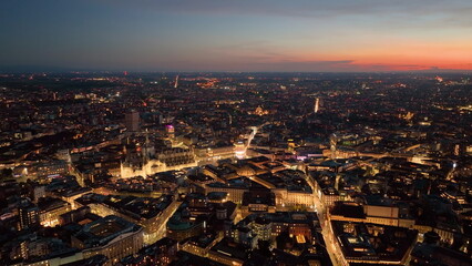 Aerial view drone of Milan financial district porta nuova skyscrapers at night, flying over city. Italy