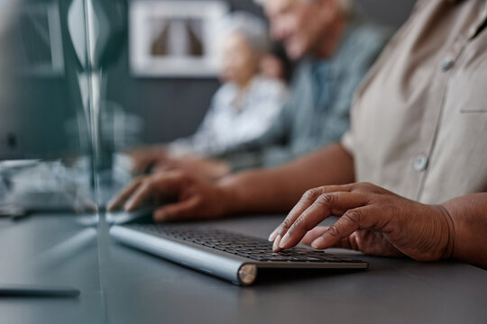 Closeup Of Elderly Black Woman Typing On Keyboard In Computer Class For Senior People, Copy Space