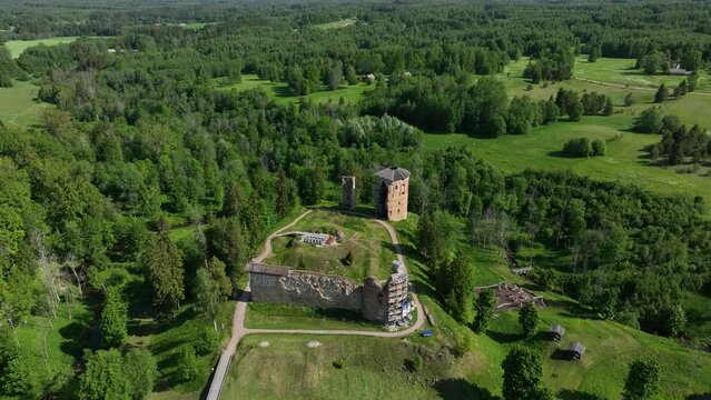 Moving away aerial view of ruins of Vastseliina Episcopal Castle. Estonia.