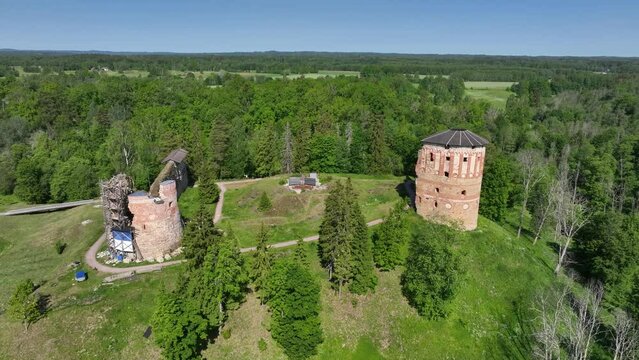 Aerial view of ruins of Vastseliina Episcopal Castle on a sunny day, Estonia.