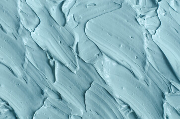 Light blue bentonite facial clay (alginate modeling mask, face cream, body wrap) texture close-up,...