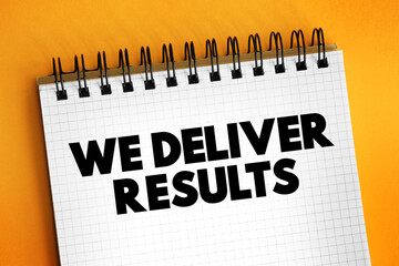 We deliver Results text on notepad, concept background