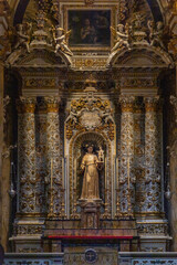 Fototapeta premium Four of the most beautiful churches in Lecce: Cathedral, Santa Croce, San Matteo, Santa Chiara. Details, frescoes, twisted columns and statues. Decorations of Lecce Baroque. View of cathedral crypt.