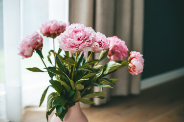 Fresh beautiful bouquet of peonies in a vase