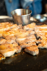 Fresh and delicious iron pan-fried black pork meal in Jeju Korean restaurant.
