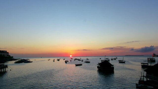 Aerial drone stock footage of the sunsetting on the horizon Zanzibar Tanzania