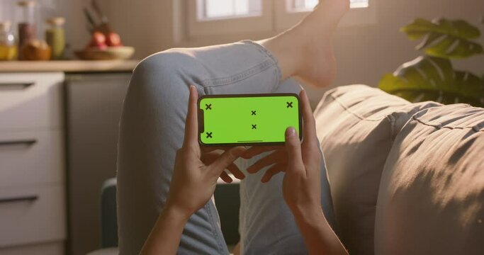 Woman use smartphone with chroma key green screen, swipe, scrol