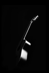 black and white acoustic guitar showing beautiful body curve rim light. music background - 613497044