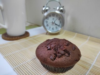Moist Chocolate Muffins, isolated on a bamboo mat.