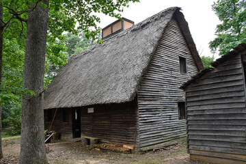 Fototapeta na wymiar Houses with roof made with straw. Early Settlement Interpretive, Henricus Historical Park, Chester, Virginia