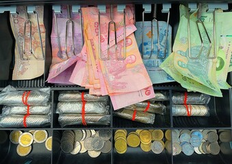Thai coins and banknotes money background financial