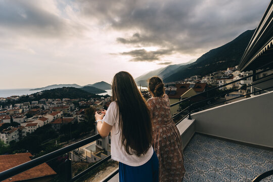 Two young girlfriends enjoy a beautiful view