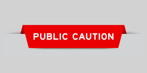 Red color inserted label with word public caution on gray background