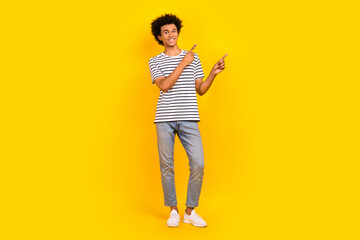 Full body photo of young handsome guy trendy apparel new clothes brand boutique point fingers novelty isolated on yellow color background