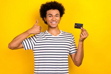 Photo of attractive young man wear trendy t-shirt recommend new monobank service debit card like...